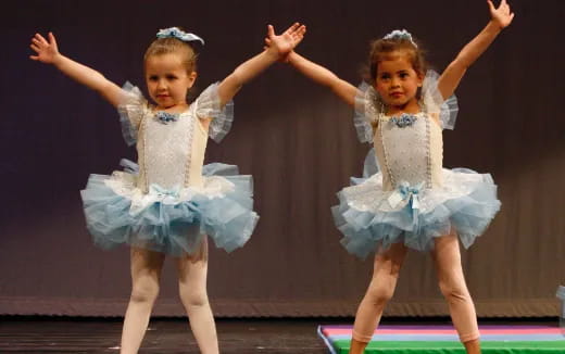 a couple of girls dancing