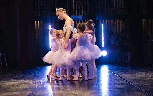 a group of women dancing on a stage