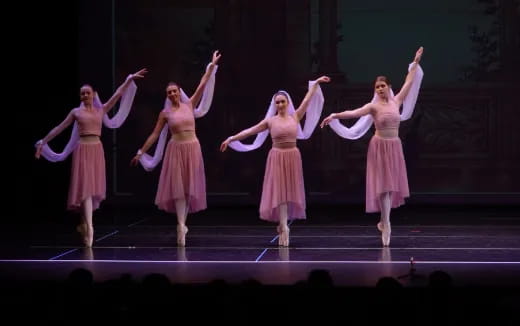 a group of women dancing on a stage