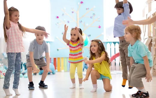 a group of children playing with bubbles
