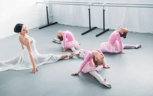 a group of women in pink clothes