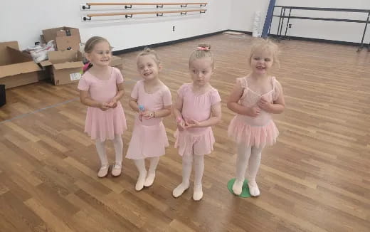 a group of girls in dresses