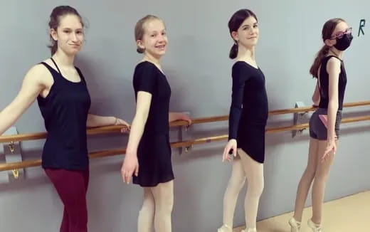a group of women posing for a photo