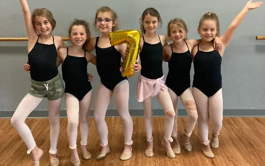 a group of women posing for a photo