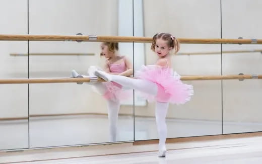 two girls in pink outfits