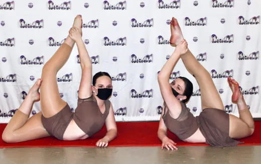 a couple of women doing yoga