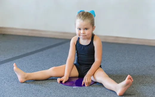 a girl sitting on the floor