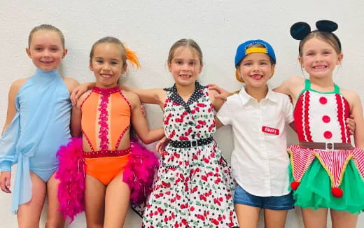 a group of girls wearing clothing