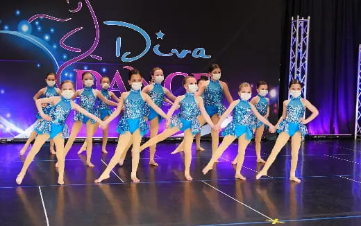 a group of women dancing on a stage