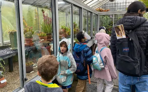 a group of people standing outside a building