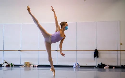a woman doing a gymnastics trick