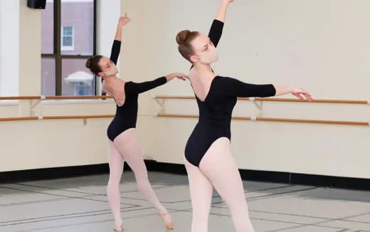 a couple of women dancing