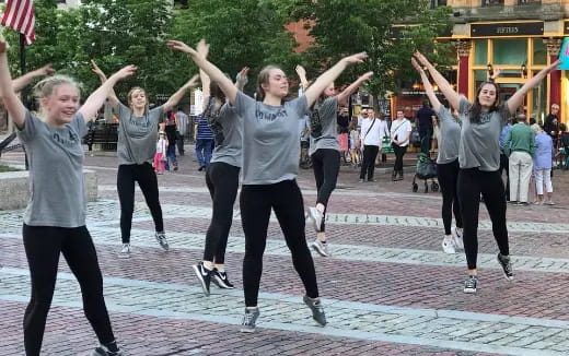 a group of people jumping in the air