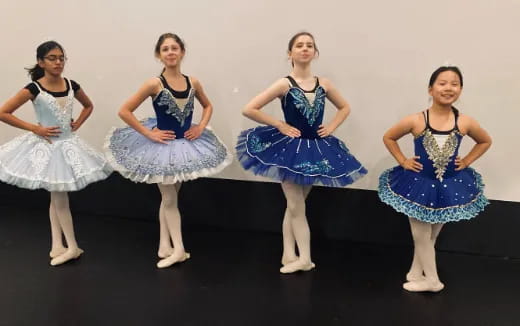 a group of women in dresses