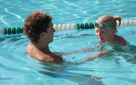a couple of women in a pool