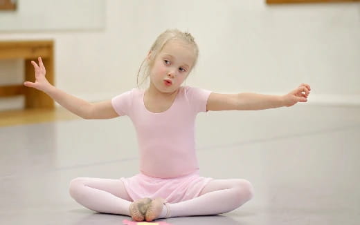 a baby sitting on the floor