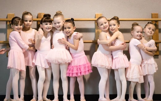 a group of girls in matching outfits