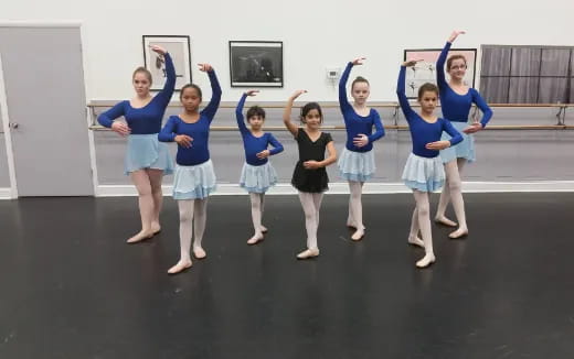 a group of girls in blue shirts