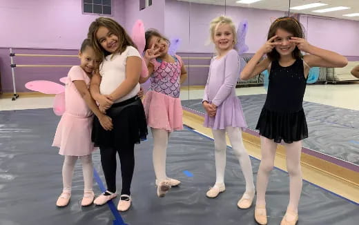 a group of girls posing for a photo