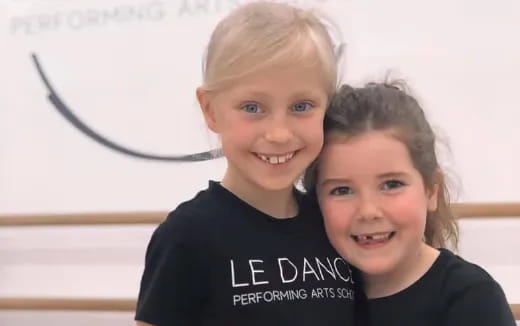 a couple of children smiling