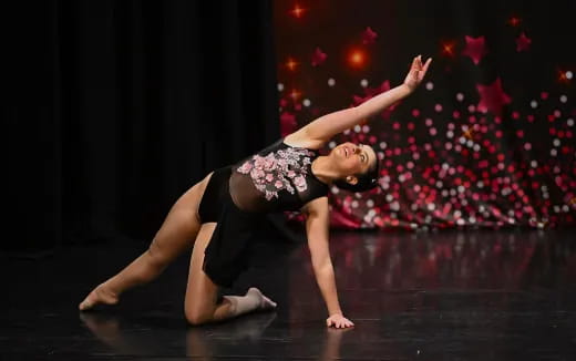 a woman dancing on a stage