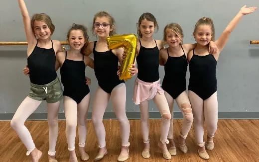 a group of women posing for a photo