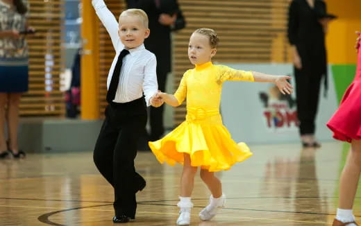 a boy and girl dancing