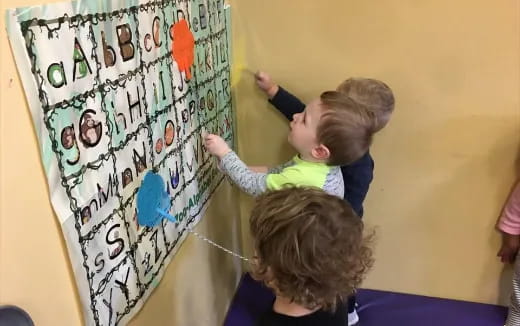 a group of children painting