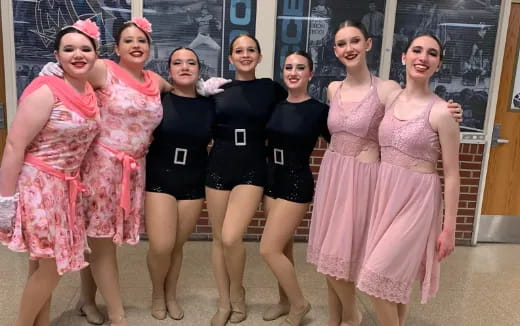 a group of women in dresses