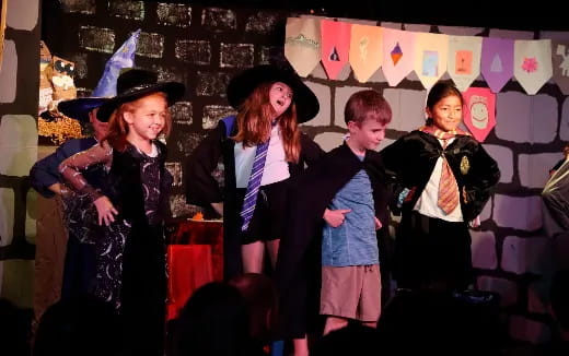 a group of people wearing graduation gowns and caps
