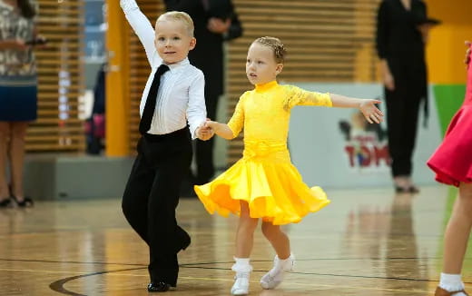 a boy and girl dancing