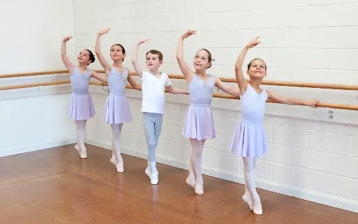 a group of girls in white dresses