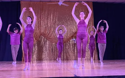 a group of women on a stage