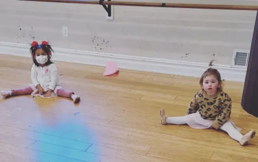 two children sitting on the floor