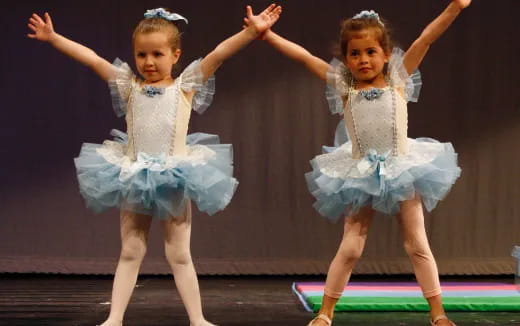 a couple of girls dancing