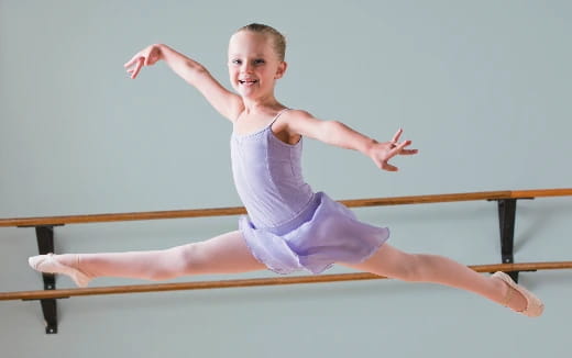 a young girl doing a plank