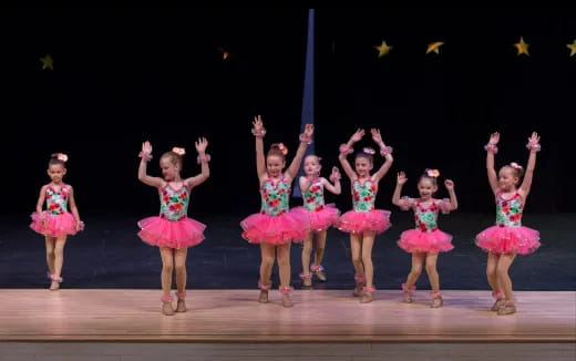 a group of girls on a stage