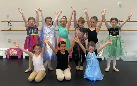 a group of girls posing for a photo