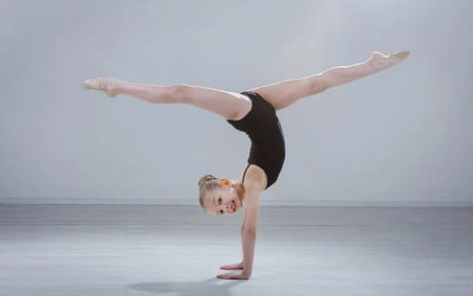 a person doing a handstand