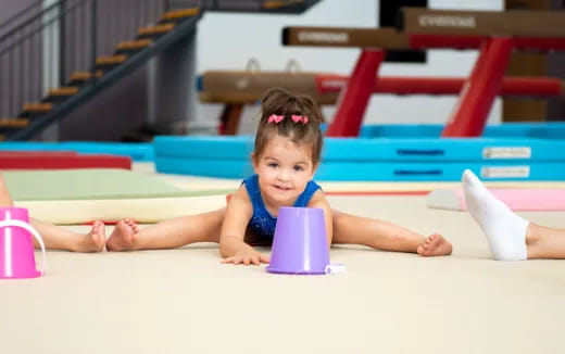 a baby lying on a mat