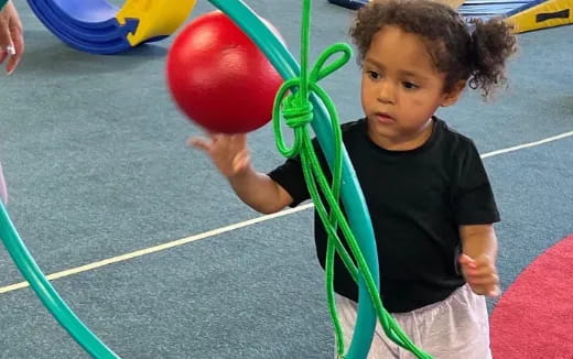 a child holding a balloon