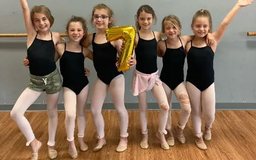 a group of girls posing for a photo