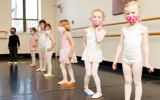 a group of children wearing masks