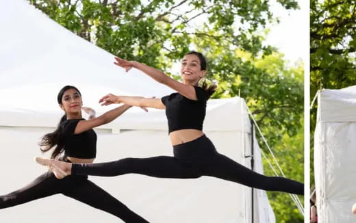 a woman in black stretching her arms