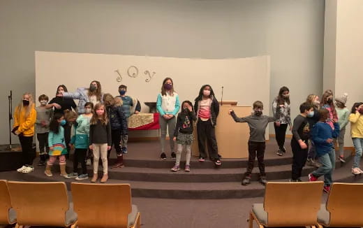 a group of people standing in a room