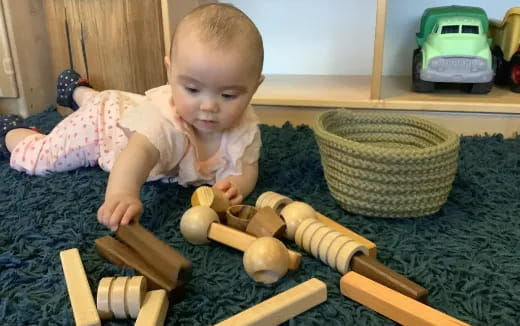 a baby playing with toys