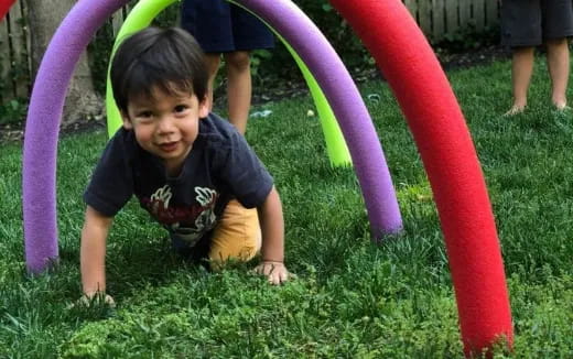 a child playing in the grass