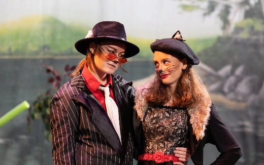 a man and woman wearing hats