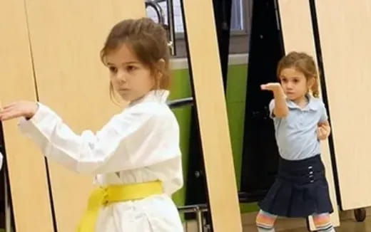 a girl holding a yellow bag and a girl standing in front of a green door