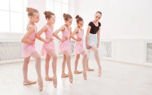 a group of girls in dresses